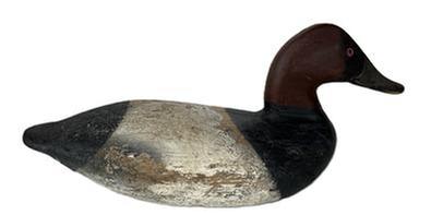 L42 Canvasback Drake Decoy carved by Taylor Boyd (1856-1946) of Perryville, Maryland. Branded "Grace" on bottom. Decoy retains working painted surface with areas of original paint showing through. Weight, staple and ring remain intact on bottom. Approximate measurements: 15 ¼ long x 6 wide x 7 tall.