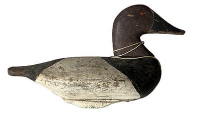**SOLD** L82 Canvasback Drake Decoy attributed to Fred Barnard (1905-1991) of Havre de Grace, MD. (Fred is a brother of the famous decoy carvers, Charles and Thomas Barnard) bearing second coat of worn working paint with traces of the original showing. The original weight remains intact on bottom. Circa 1945. Approximate measurements: 15 long x 6 ¼ wide x 9 tall.
