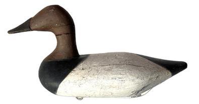 K143 High head Canvasback Drake Decoy by Havre de Grace, Maryland carver Bob McGaw (1879-1958). Original staple, ring, and weight intact on bottom. Surface bears multiple layers of old working paint with original painted surface showing in some areas.