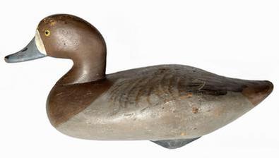 J247 Bluebill Hen decoy carved by Madison Mitchell Havre de Grace, MD (1901-1993) retaining its original painted surface. Original weight and staple remain intact on bottom. Circa 1940's.