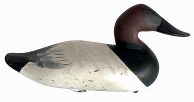 **SOLD** J318 Canvasback Decoy carved by Charlie Speed Joiner (1921-2015) of Chestertown, MD. Original paint with wide bill, signed and dated 1965 retains original iron weight and ring on bottom. Approximate measurements: 15 1/2" long x 6 3/4" wide x 8 1/4" tall