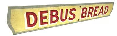 **SOLD** J401 Wood Advertising Sign for Debus Bread. Single sided with the lettering being hand painted in red with white and dark red shadowing on a yellow background. A sage green painted border surrounds the edges of the sign. Measurements: 36” wide x ¾” thick x 5 5/8” tall (NOTE: Debus was founded in 1923 in Exeter Nebraska and was sold out to Metz Baking Co. of Sioux City, Iowa in February 1964.)