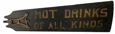 **SOLD** J42 Early 20th century double sided Restaurant Advertising Trade Sign painted on a wooden fan blade. One side reads “HOT DRINKS OF ALL KINDS” and the reverse side reads “PORK & BEANS”. Great hand-painted stenciled lettering on a black painted background. Original early metal fan bracket/hardware remains intact on one end and an early applied wooden batten remains intact on larger end. Tight cracks in wood. Circa 1900-1910. Approximate measurements: 28 5/8” wide and tapers from 3” tall to 8 5/8” tall.
