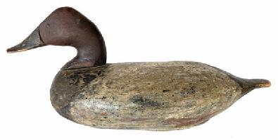 **SOLD** G144 Early Canvasback decoy from Havre de Grace, Maryland in old working paint. Carver unknown. Tack eyes. Primitive, extremely early repair by tail. Original single nailed lead weight remains intact on bottom.