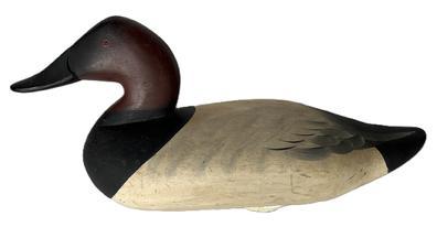 K1631 Canvasback Drake decoy - 1965 model (wide bill) carved by Charlie �Speed� Joiner (1921-2015) of Chestertown, MD.- double branded "R N C" (Ronald Coleman Rig) on bottom. Decoy retains its original painted surface with the original weight, staple and ring all remaining intact on bottom.  