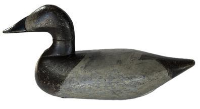 K1761 Canvasback Hen decoy carved by Robert McGaw (1879-1958) of Havre de Grace, Maryland. Original �dog bone� weight, staple and ring remain intact on bottom.   