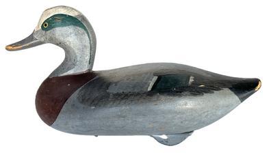 K1681 Signed and dated Wigeon Duck Decoy carved by R. Madison Mitchell (1901-1993) from Havre de Grace Maryland. Decoy retains its original painted surface and bears electric pencil signature / date: "R. Madison Mitchell � 1960�, along with original weight, staple and ring on bottom. Decoy has a great dry surface never oiled or waxed. 