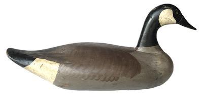 K1512 Canadian Goose decoy carved by Madison Mitchell, Havre de Grace, MD (1901-1993) retaining its original painted surface. Original staple/ring intact on bottom � weight is missing. Damage to tip of bill. Full body sized goose decoy measuring approximately 24" long x 11� tall x 10� wide. 