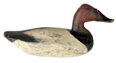K1843 Canvasback Drake decoy, carved by James A. Currier (1886 � 1971) of Havre De Grace, Maryland. This Decoy retains second coat of working paint. Original weight, staple and ring remain intact on bottom.  