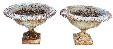 **SOLD** K179 Late 19th century Matching pair of ornate Cast Iron Garden Urns retaining old white painted surfaces. Urns are solid cast iron with leaf patterned rims resting on square bases. Measurements: 21” across tops (openings are 15 ½” diameter) x 7 ¼” square bases x 13 ½” tall