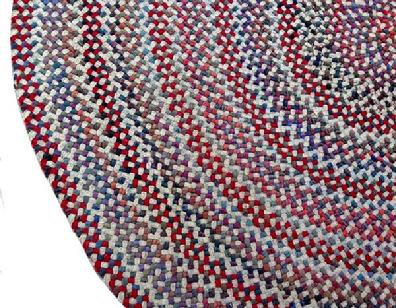 A191 Early 20th century hand made braided rug from Pennsylvania, with great workmanship and colors of red, white and blue and other colors