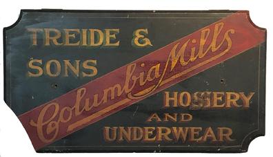 F68 Late 19th Century wooden trade sign from Baltimore, Maryland for Treide & Sons Columbia Mills Hosiery and Underwear. The sign is painted on single board, with a black background and red, green and mustard lettering. Treide & Sons was founded in 1869 and was located at the S E corner of Hopkins Place and German Street in Baltimore. Measurements are: 36" wide x 20" tall