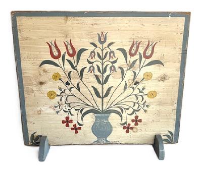 M74 Folk Art hand painted wooden Fireplace Screen depicting a large Urn of Flowers on a white background with a blue painted border and feet. Signed and dated (91) by the artist in lower right corner. Applied battens on back have kept the board from twisting / warping. Wooden feet at the bottom allow for sturdy display of this great piece of Folk Art!