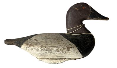 L82 Canvasback Drake Decoy attributed to Fred Barnard (1905-1991) of Havre de Grace, MD. (Fred is a brother of the famous decoy carvers, Charles and Thomas Barnard) bearing second coat of worn working paint with traces of the original showing. The original weight remains intact on bottom. Circa 1945. Approximate measurements: 15 long x 6 ¼ wide x 9 tall.  