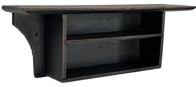 **SOLD** E234 19th century Wall Shelf with the original black paint. The wood is pine. Very unusual form with mortised shelves and chamfered edge below the top and along the bottom. Measurements: 35 ¾ long x 8 ½ deep (top) x 12 ½ tall.   The shelves are 6 deep.  