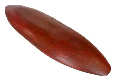 **SOLD** K1652 Unusual 19th century long, narrow, oval shaped wooden trencher bearing original red painted surface. Dry, natural patina interior. Hand hewn from a single piece of wood, bearing drawknife marks throughout both sides of the trencher. Measurements: 32 ½ long x 10 ¼ wide in middle, tapering to 2 on ends. 2 ¼  2 ½ deep, depending on where measured. 