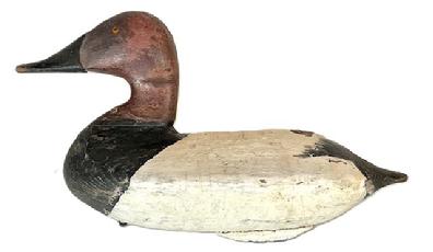 RM1577 Canvasback Drake decoy carved by Carroll "Wally" Algard (1883-1959) of Charlestown, Maryland with semi-high head and high neck shelf, bearing second coat working paint. Original weight and staple intact on bottom. Algard was a railroad track foreman who worked for the Pennsylvania Railroad. He was also a waterfowl hunter who made fine decoys.