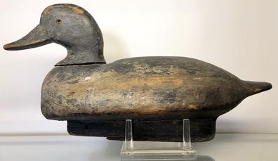 E291 Early Black Head Decoy, carver unknown. Decoy is from the Mill Creek area in Anne Arundel County, MD – just north of the Severn River. The “C” brand on the bottom stands for “Cantler” – which represents the family who owned the decoy rig. This is an outstanding decoy with an unusual wooden keel reinforced with a lead strip around the entire bottom of the keel. Circa 1920’s.