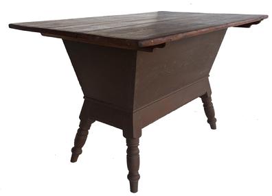 Early 19th century painted dough box on stand, (circa 1820) with wonderful Spanish reddish brown over the original red paint found in Lancaster County Pennsylvania . Dove-tailed case, with very gracefully turned splayed legs with removable lid , measurements 48 1/2” long. 29 1/2” wide. 28 1/4” tall