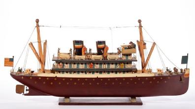 E123 Exceptional detail early 20th century carved and painted ,Folk Art carved and painted Steamship Model with shipmates in blue-painted shirts, and passengers. Retains original painted and varnished surface with warm color. 11 1/2"x 23"