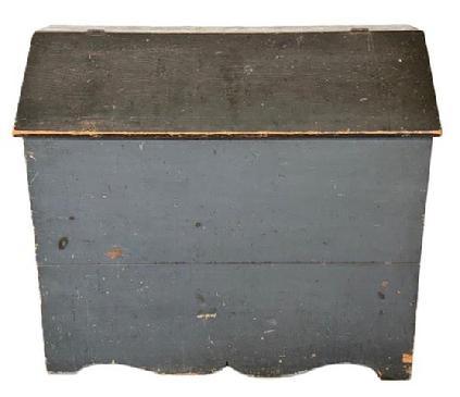 M56 Exceptional 19th century Pennsylvania Bin with divided interior in its original blue painted surface with cut out ends and decorative cut out drop apron. Battens inside the lid have kept the lid from twisting / warping over the years. The wood is pine with square head nail construction. Circa 1850s. Measurements: 45” wide x 19 ¼” deep x 39 ½” x tall (back).