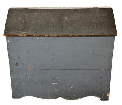 M56 Exceptional 19th century Pennsylvania Bin with divided interior in its original blue painted surface with cut out ends and decorative cut out drop apron. Battens inside the lid have kept the lid from twisting / warping over the years. The wood is pine with square head nail construction. Circa 1850s. Measurements: 45 wide x 19 ¼ deep x 39 ½ x tall (back).