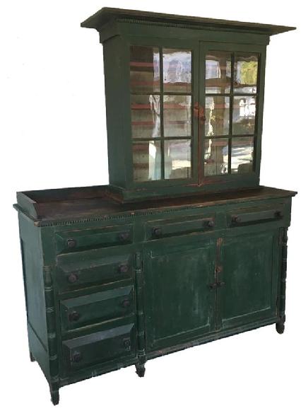 E358 Striking Southern Wythe County, Virginia Stepback / Server. This is one of two known examples in this rare form, having offset drawers on one side with a work surface, and a traditional Stepback on other side. The exterior of this two-piece cupboard retains an old green paint over the original red, the interior is an oyster white. All square nail construction with outstanding beveled drawer fronts and deep chamfered door panels, side panels and back boards. Made of Cherry and Poplar woods. There are very unusual turned quarter-round moldings applied to areas on both top and bottom of this cupboard showing the cabinetmaker's skills. The very simple turned half-round columns and also a turned half-round base molding adds to the exquisite details of this piece. This rare