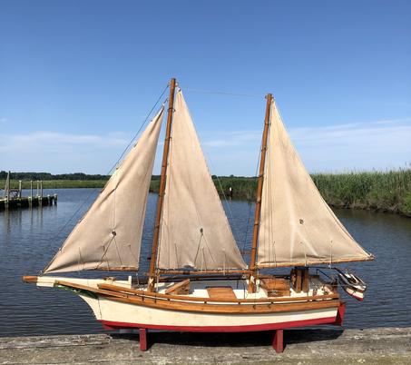 E172 Chesapeake Bay Bugeye, hand made model replice of ( not a kit ) great condition. A bugeye is a two masted sailing vessel used for dredging Oysters.They descended from the log canoe in the time when the need was for a large boat. The Schooners of the day were too large and the canoe was too small. They came into being around 1875.There are only a few of Theses grat boats. 10 3/4" wide x 44" long x 33 3/4" tall
