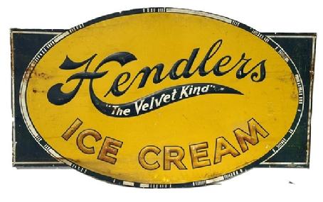 M1101 Super metal Trade Sign advertising Hendlers Ice Cream - The Velvet Kind. Sign is in great condition with original blue, yellow, white and gold painted surface and remnants of sign makers mark remains in lower right corner M
.5711. Hendlers was manufactured in Baltimore, Maryland - started in 1905 and grew into one of the most famous and iconic brands, being sold in over 400 stores throughout the state at the Companys peak. The Borden Company purchased the company in 1929, yet it continued to operate under the Hendlers Creamery name until the late 1960s. Measurements: 51 ¾ wide x 31 ½ tall.