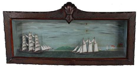 B6 Original, mid 19th century antique diorama clipper carved and painted and displayed in the original frame. diorama of two sailing ship, hand carved wooden ships, with outstanding painting of houses and light house in the background, with the American Flag on the yellow house.