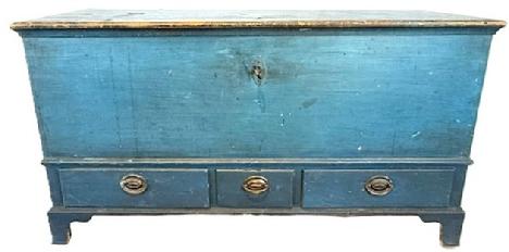 **SOLD** L532 Stunning 18th century Pennsylvania Blanket Chest with three dovetailed drawers bearing old blue (19th century) paint over original pumpkin painted surface. Chest retains its original strap hinges and working crab lock with key. Dovetailed case with applied molding surrounding the lid, resting on an applied bracket base with tall cut out feet. Clean, natural patina interior boasts a lidded til with molded edge and a very unique locking system for the drawers below. Rosehead nail and wooden pegged construction. Circa 1750s. Measurements: 50 wide x 22 deep x 26 ½ tall.