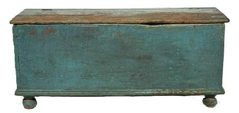 **SOLD** M151 Early 19th century Lancaster County, Pennsylvania original blue painted lidded wood box resting on turned feet. Applied molding around bottom and rounded edges surround the lid. Dovetailed case. Clean, natural patina interior. One board construction. The wood is pine. Circa 1820s-1840s. Measurements: 50 ¼ wide x 17 ¼ deep x 22 ¼ tall.