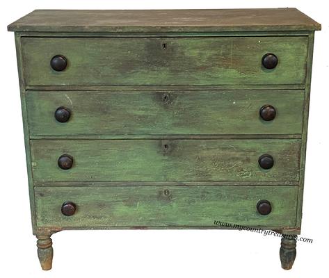 LL1 Early 19th century four drawer pine Chest , found in Buck's County Pennsylvania. This Chest is beautiful in the original dry green paint. The case is dovetailed top and bottom, and the drawers are also dovetailed, it is resting on nicely turned feet. This Chest is one board construction circa 1820 measurements are 18" deep x 42' wide x 38" tall
