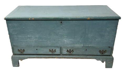 **SOLD** M315 Stunning 18th century identified Pennsylvania Chippendale blanket chest retaining old blue over original blue painted surface with a dovetailed case and two dovetailed drawers resting on a high applied bracket base with dovetailed feet. Lid has breadboard ends and molded edge. The wood is pine, six board dovetail construction. Clean, natural patina interior boasts a lidded till with beaded edge and a hidden drawer below. The back of the drawer is signed William Pearson I am on one side and the name Charles Sopris is etched in the opposite side. Circa 1780s. Measurements: 49 wide x 19 ¾ deep x 26 ½ tall.