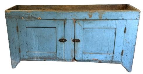 **SOLD** M266 Fantastic 19th century unusual wide, open well blue painted Pennsylvania drysink. The wood is pine with square nail construction resting on cut out feet. The two fully mortised doors open to reveal a clean interior with a single fixed shelf.