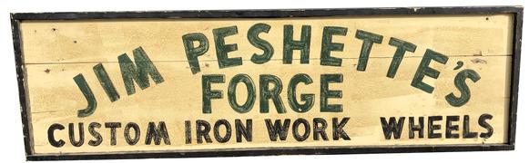 E77 Early 20th century trade sign " Jim Peshette's forge custome iron work and wheels",advertise early iron wheels for Model T's and wagon's , painted on board with applied molding one sided , black letter on a off white back ground. Found in Pa purcased from a private sign collection, Measurements are: 18 1/4" high x 61 3/4" wide x 2 1/4" deep