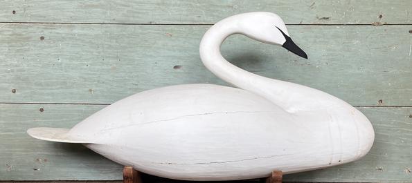 **SOLD** K1559 Full Size Swan Decoy bearing original hand painted surface. Gracefully carved in a natural swimming pose with a unique paddle shaped tail. Unknown carver. Custom base included for display purposes. Approximate measurements:  ~42 ½ long x ~11 wide x ~18 ½ tall. (~22 ½ tall on stand) 
