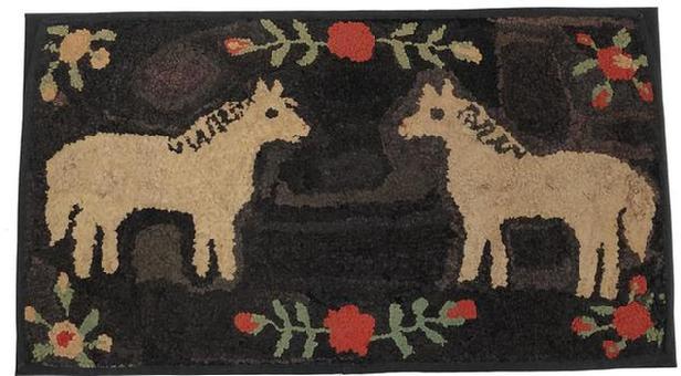 C551 Late 19th century Double-Horse Hooked Rug, Pennsylvania , it is rare and desirable to see two horses on the same rug. The standing pose is further energized by the striated black back ground, with red and white flowers with green leaves ,