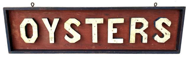 F406 Wonderful Oyster Trade Sign with applied wooden letters. Originally found on the shore of New Jersey, and dates from the 1890's - 1900's. The sign has its original red white and blue painted surface, red back ground, with white letter, with blue shadowing as well as a blue applied frame. A mixture of square head and wire head nails.