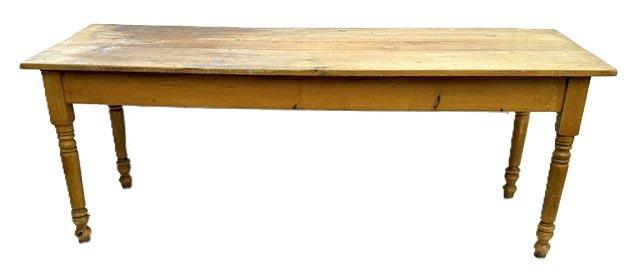 ET2 (G340) Nice, sturdy late 19th century Lancaster County, Pennsylvania original mustard grain painted Harvest Table. The apron is mortised and pegged into the turned legs. Great wear. Circa 1860s-1880s. Measurements: 80 ¼ long x 29 ½ wide x 30 ¼ tall. Apron to floor clearance is 23 ¾ tall.