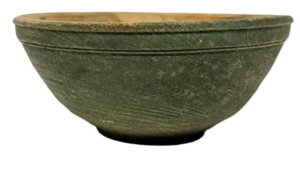 M1146 Small wooden footed bowl with evidence of slow lathe turnings throughout bearing beautiful, dry, original Windsor green painted surface. Crisp lipped edge and prominent footed base. Out of round. No cracks.